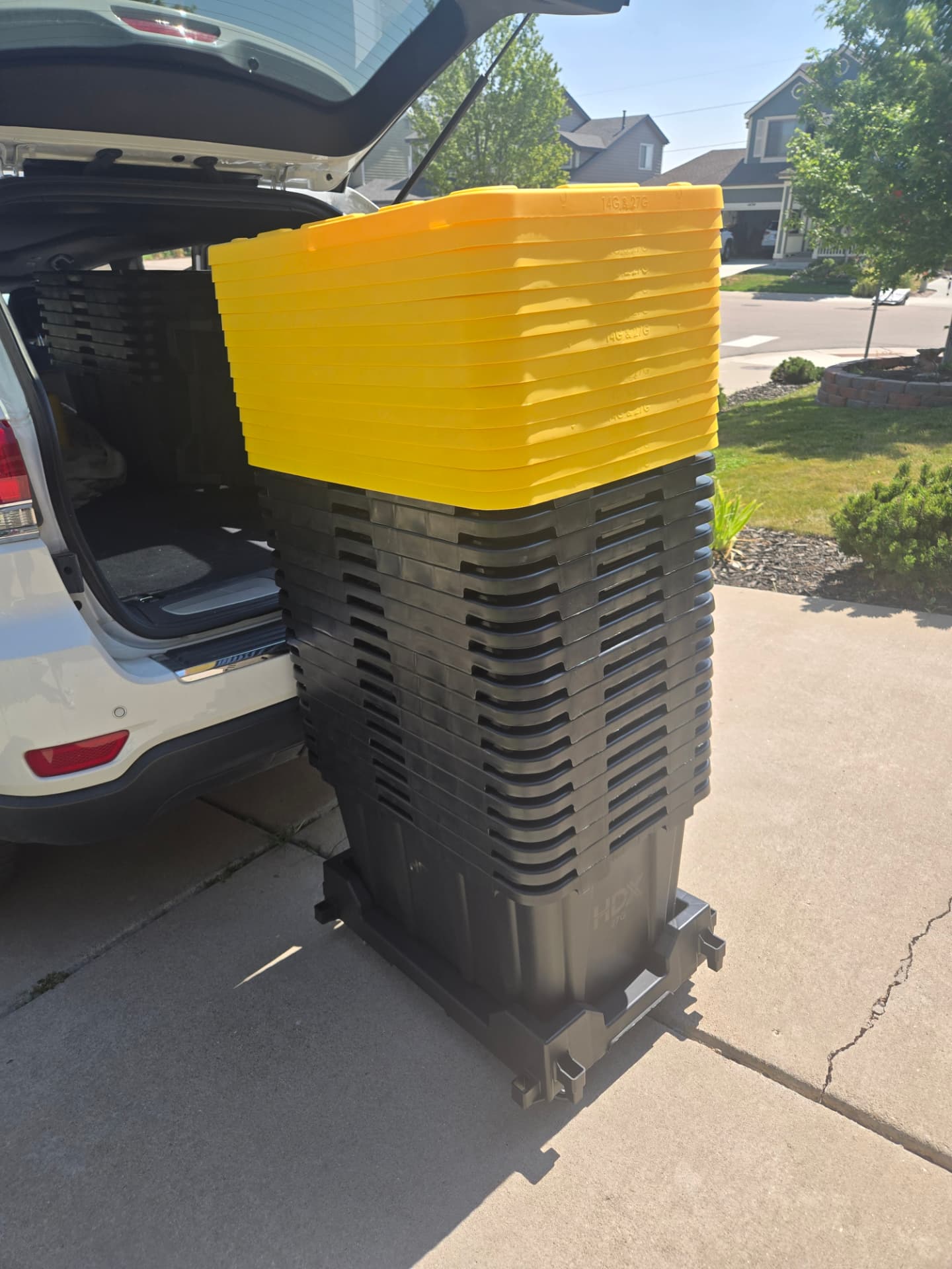 Stacked reusable moving totes ready to be packed for a Denver move