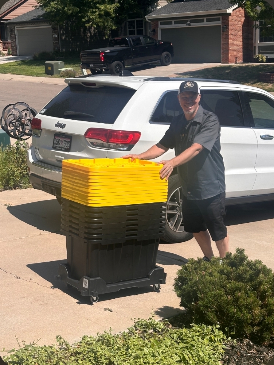 Reusable moving totes and a Tote Taxi being delivered to a Denver home